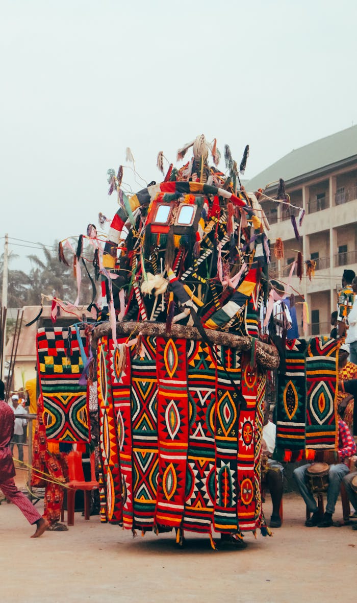 Colorful masquerade dance captured in Enugu, Nigeria, showcasing rich cultural attire and traditions.