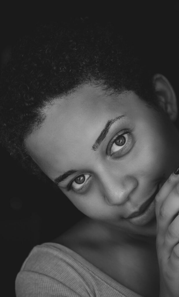 A captivating black and white portrait of a woman with a serene expression.